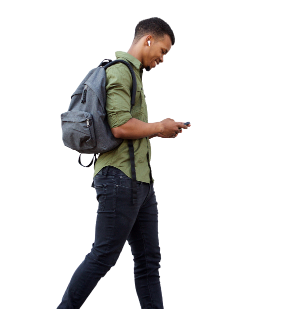 Young man walking with looking at mobile phone